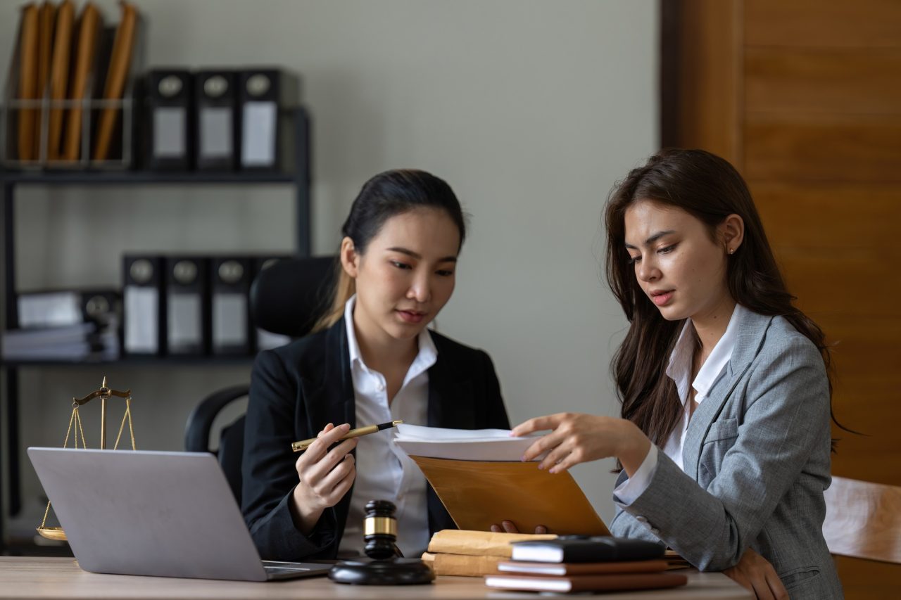 businesswoman and female lawyer consult having team meeting with client law and legal.jpg